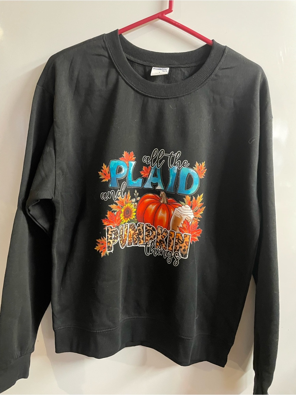Women’s Black Pullover Sweatshirt with Pumpkin Plaid Graphic